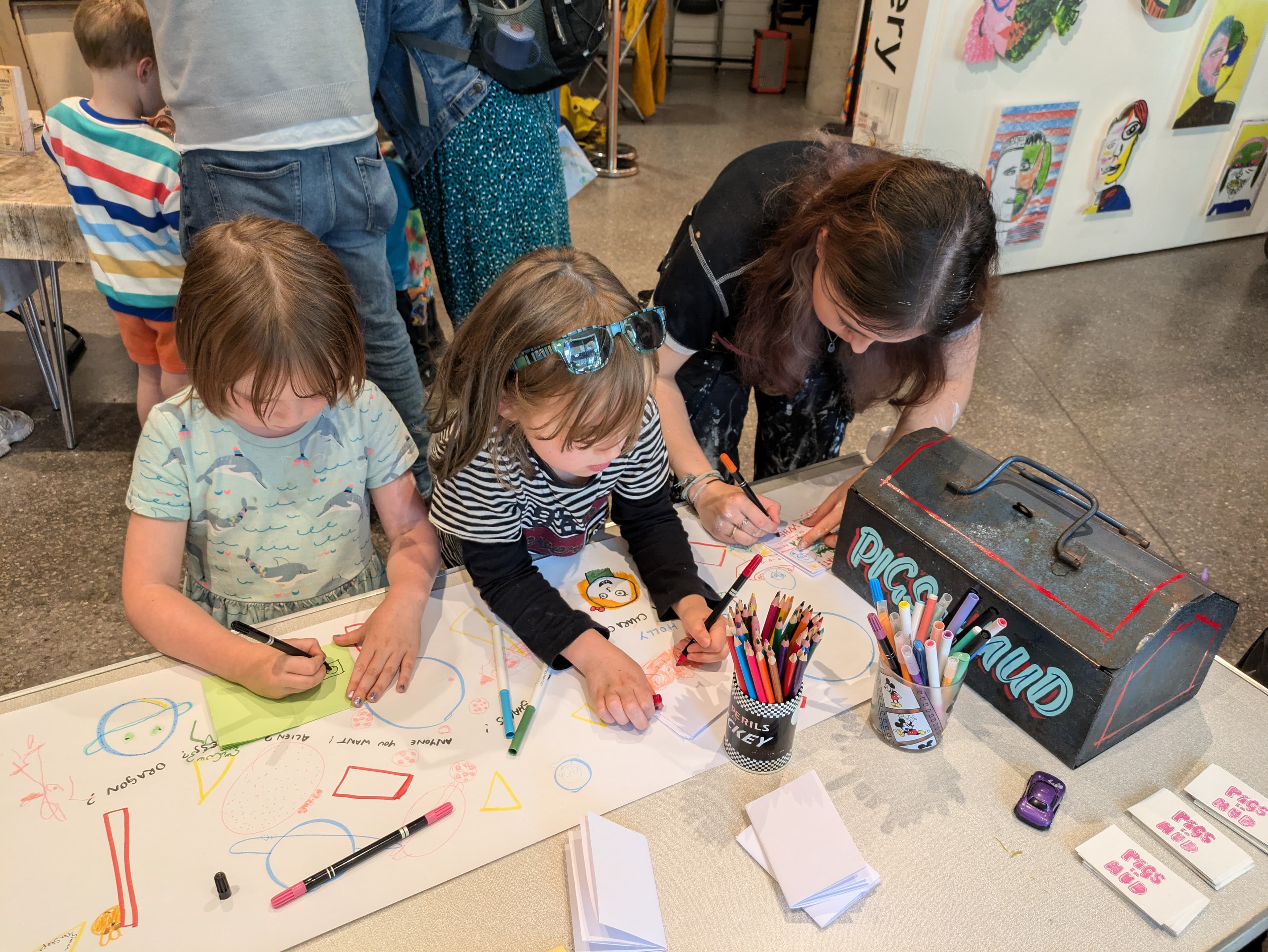 Artists working on a mural